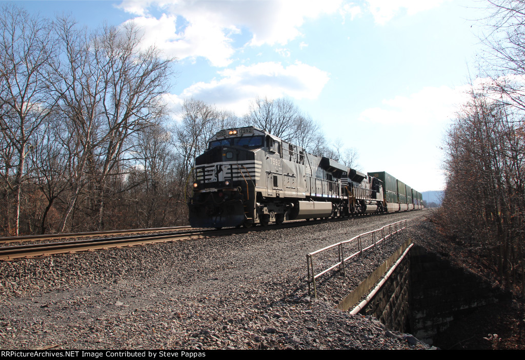 NS 7592 leads a short stack train at MP 124.4